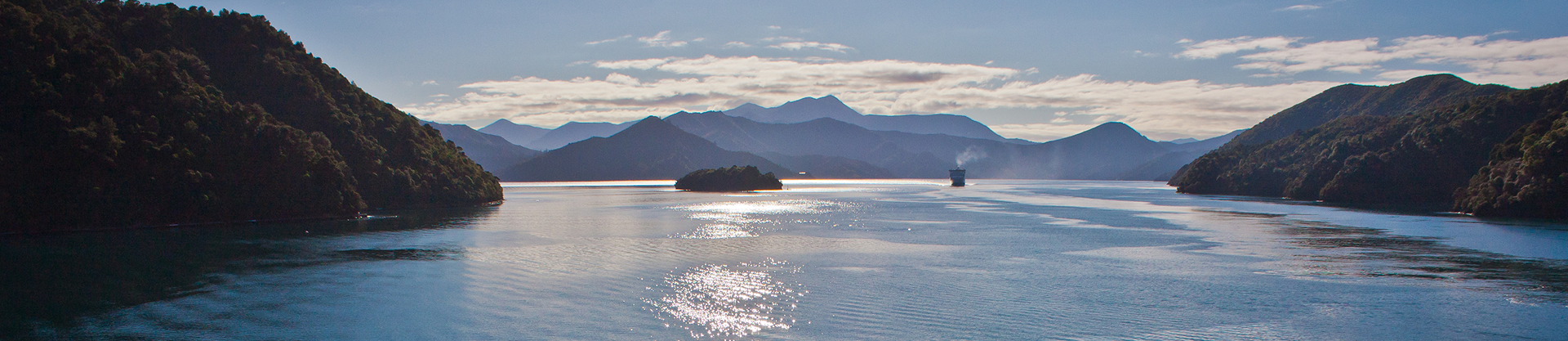 Ferry sailing through the Marlborough Sounds in New Zealand